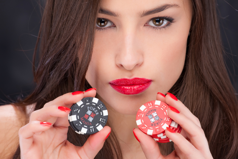 Woman holding gambling chips